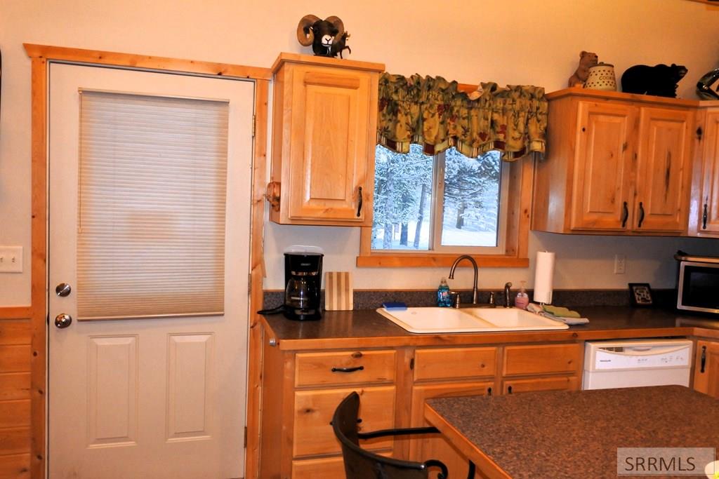 Front door leads into open kitchen