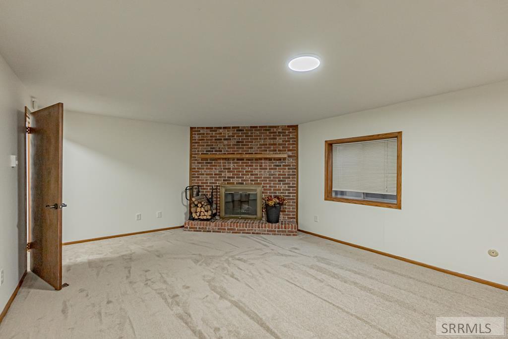 Wood fireplace in Family Room