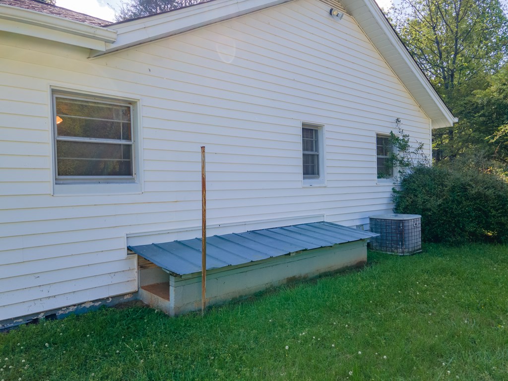 Lift up Metal Roof for stairs to Partial Basement