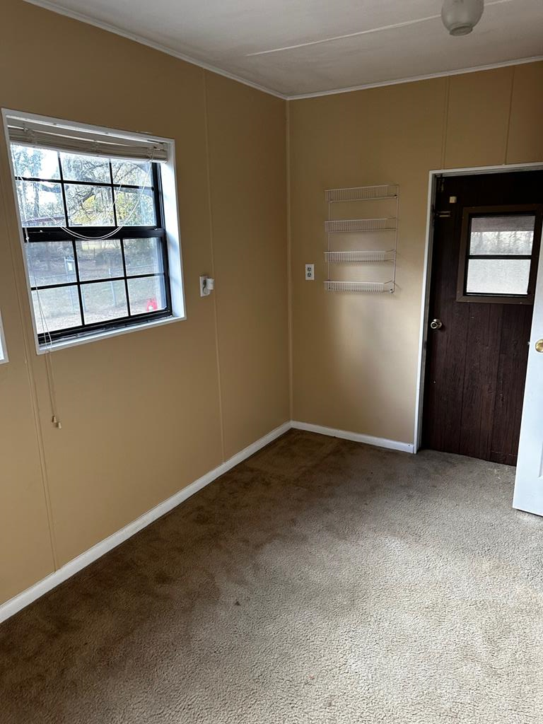 Sitting area or storage area off of main bedroom
