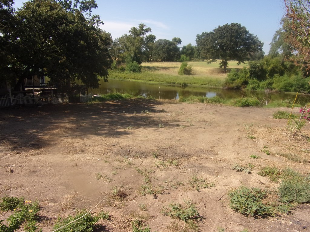 view of lot toward the pond and ranch on other sid