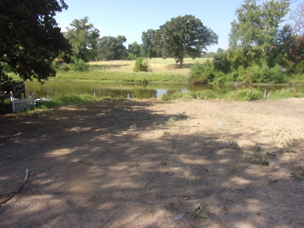 another view of lot toward the pond and ranch behi