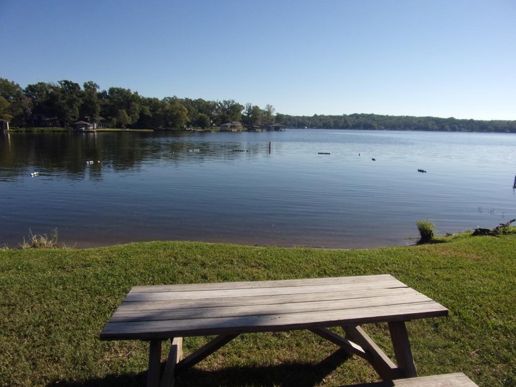 community lake swim area with picnic table