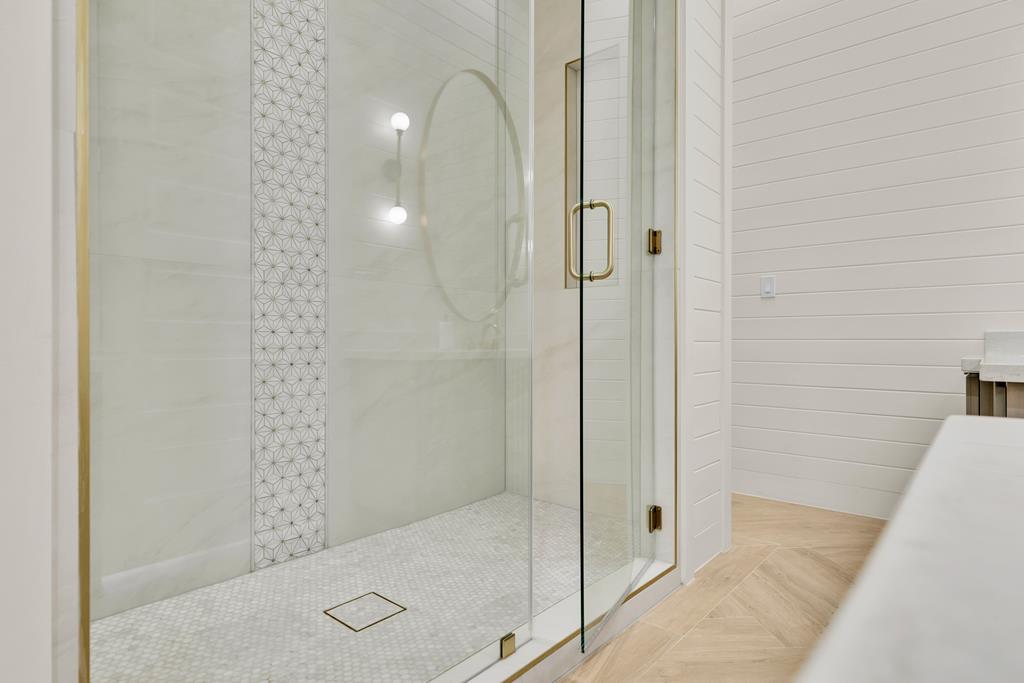 Stunning floor to ceiling master shower with dual 