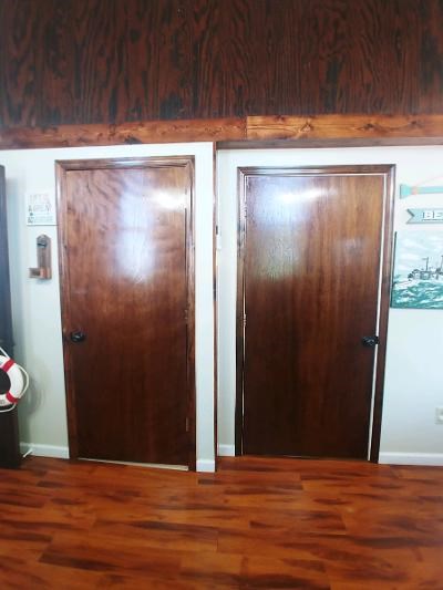 Wide Wooden Doors Leading to Bathrooms