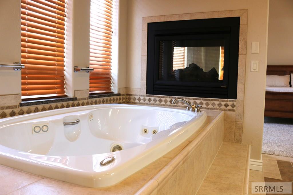 Master jetted Bathtub with electric fire place