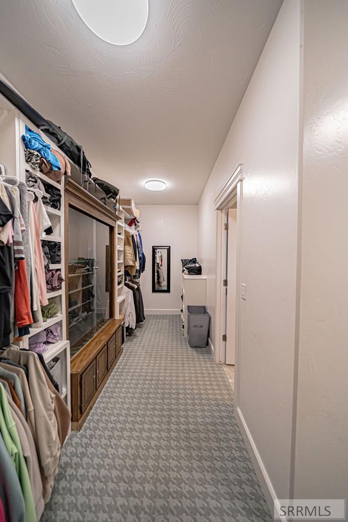 Primary Walk-in Closet with Washer and Dryer
